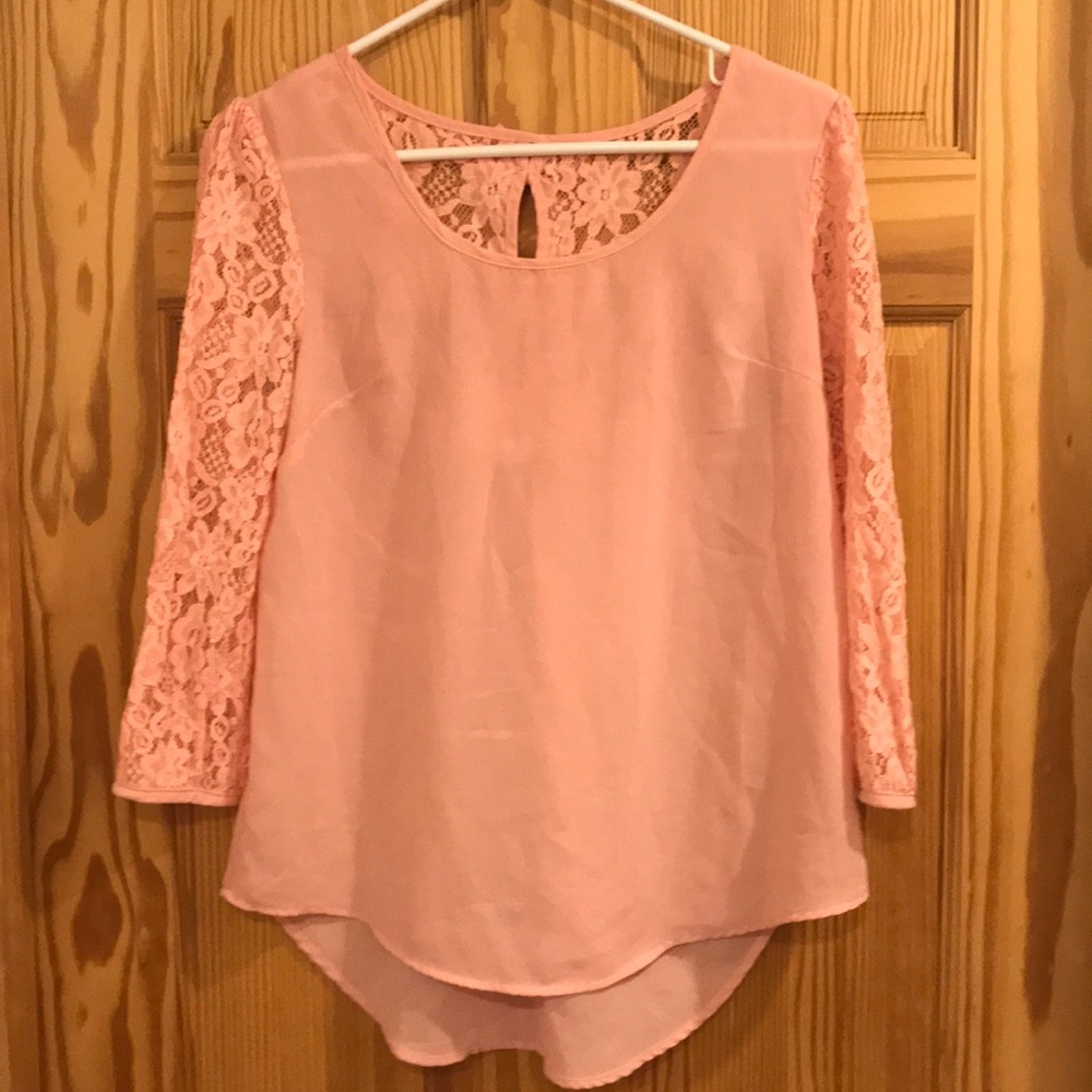 Iight pink blouse with lace and bows